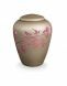 Glass cremation urn with apple branch - symbol of nature and life