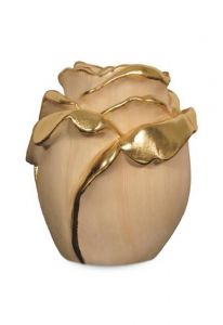 Rose cremation urn for ashes made of limewood with gold-colored accents