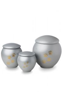 Light grey pet urn with gold coloured paws