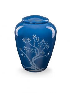 Glass urn for ashes with flying doves - a symbol of peace and love