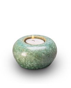 Ceramic keepsake urn with a candle holder