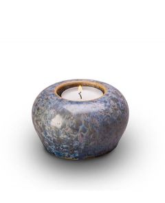 Ceramic keepsake cremation ashes urn with a candle