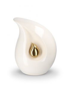 Teardrop cremation urn for ashes made of white ceramic with small gold-colored teardrop