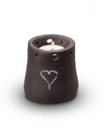 Ceramic keepsake cremation ashes urn with a candle